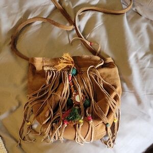 Free People Tan Crossbody Bag with Fringe and Bohemian Flair.